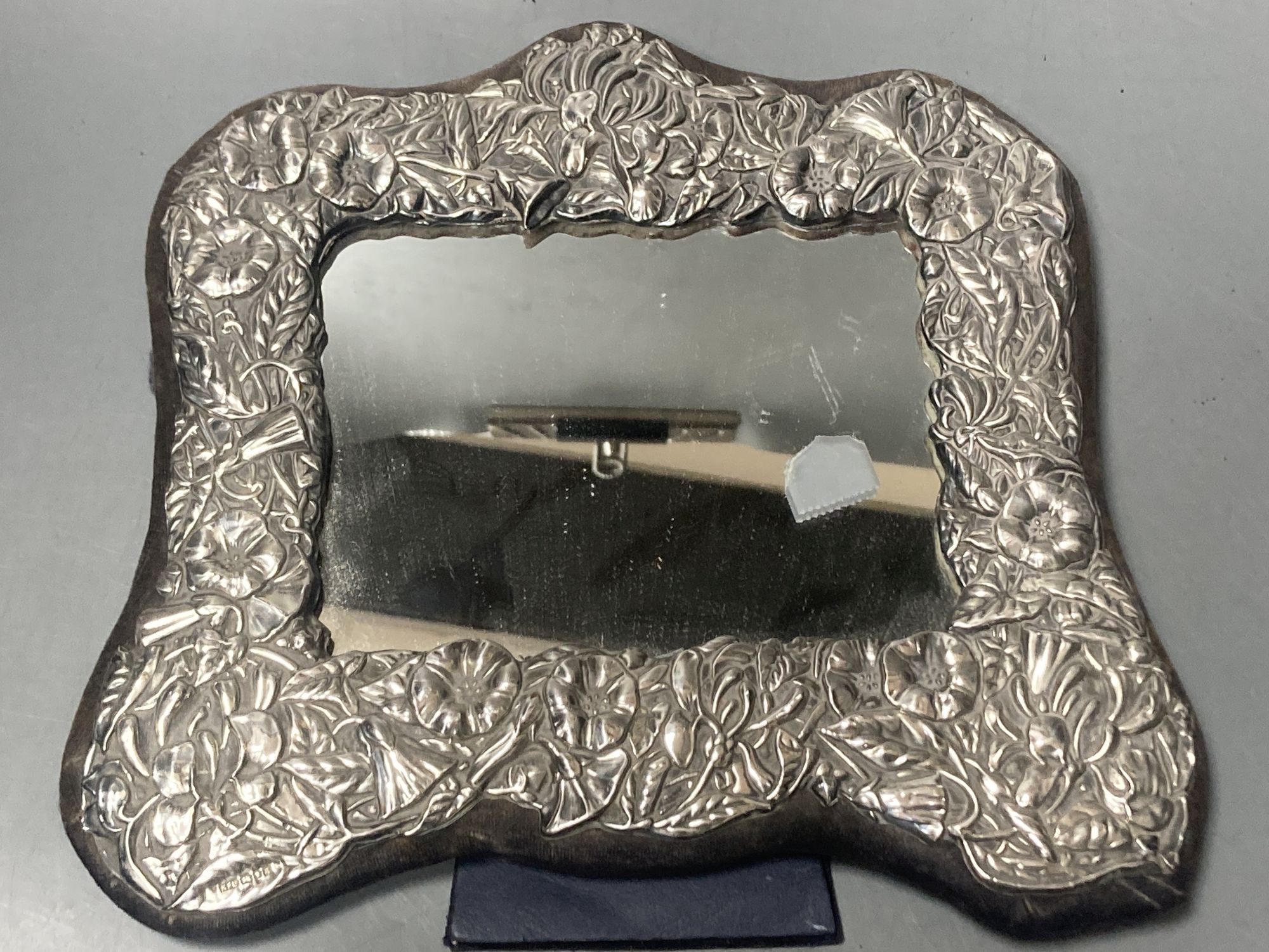 A pair of George V silver mounted photograph frames, Boots Pure Drug Company, Birmingham, 1918, 19.5cm & 1 other frame.